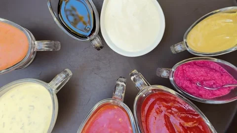 Various hot sauces are on the table in a restaurant, food, chili, ketchup Stock Footage 325033572