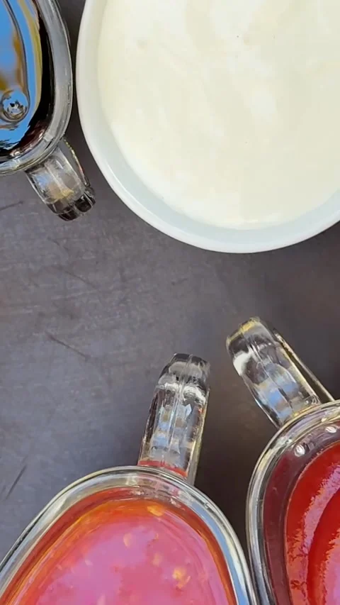 Various hot sauces are on the table in a restaurant, food, chili, ketchup Vídeos de archivo 326465640