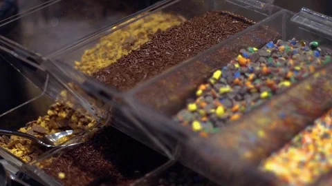 Various ice cream toppings in containers 스톡 동영상 104661022