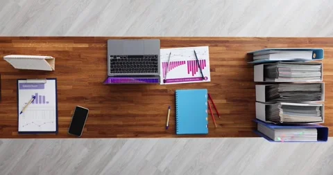 Various items are stacked on desktop in office top view hyperlapse Stock Footage 257664452