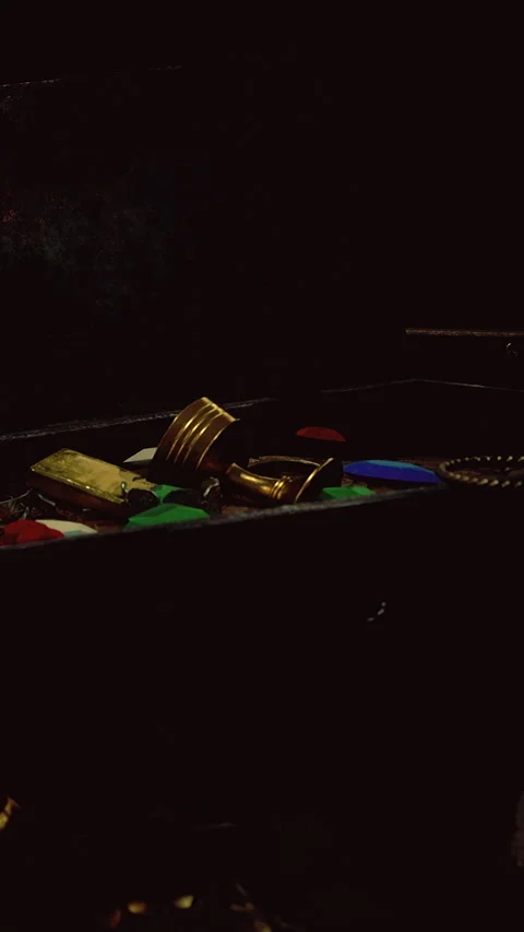 Various items in a dark box with a figure present in the background Stock Footage 336167345
