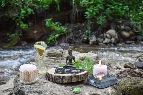 Various items for rituals and divination on a large stone on the background o Stock Photos