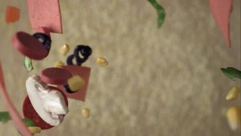 Various kind of toppings drop onto a pizza dough in slow motion Stock Footage 161525786