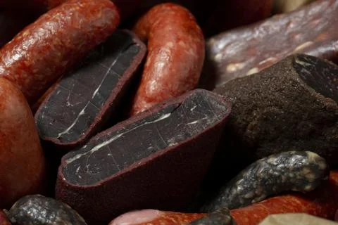 Various kind types of cold meats, salami and sausages in a wooden  a box Stock Photos