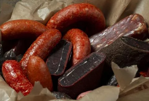 Various kind types of cold meats, salami and sausages in a wooden  a box Stock Photos