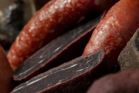 Various kind types of cold meats, salami and sausages in a wooden  a box Stock Photos