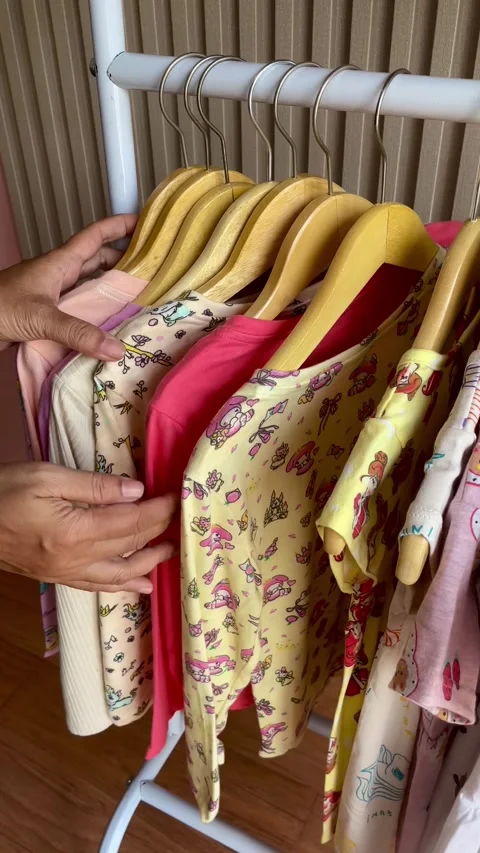 Various kinds and colors of children's clothing Stock Footage 283972553
