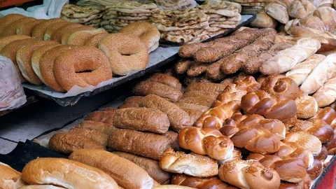 Various kinds of fresh Bread at a local bakery Stock Footage 89643537