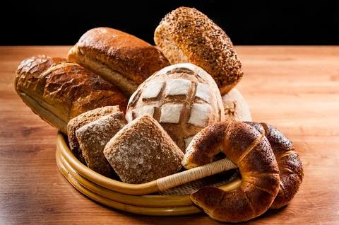 Various kinds of fresh bread on the table Stock Photos