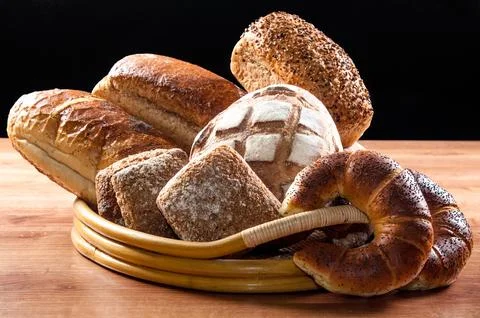 Various kinds of fresh bread on the table Stock Photos