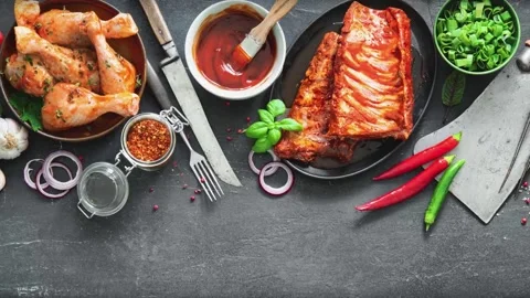 Various kinds of grill and bbq meats with vintage kitchen and butcher utensi Video stock 281359494