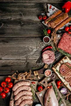 Various kinds of grill and bbq raw meats. Chicken, steak, sausages, minced .. Stock Photos