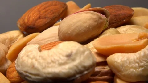 Various kinds of nuts spinning close up Stock Footage 121651791