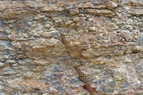 Various layers of rock are visible, showing different textures and colors Stock Photos