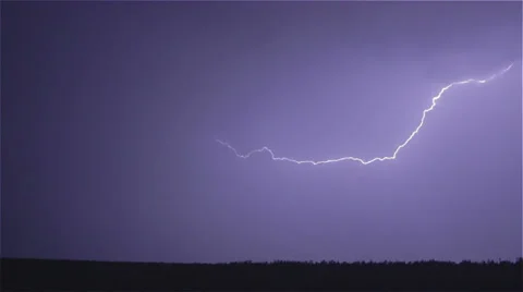 Various lightning bolts strike forest night landscape, sound included Stock Footage 24441454