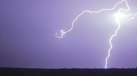 Various lightning bolts strike forest night landscape, sound included Stock Footage