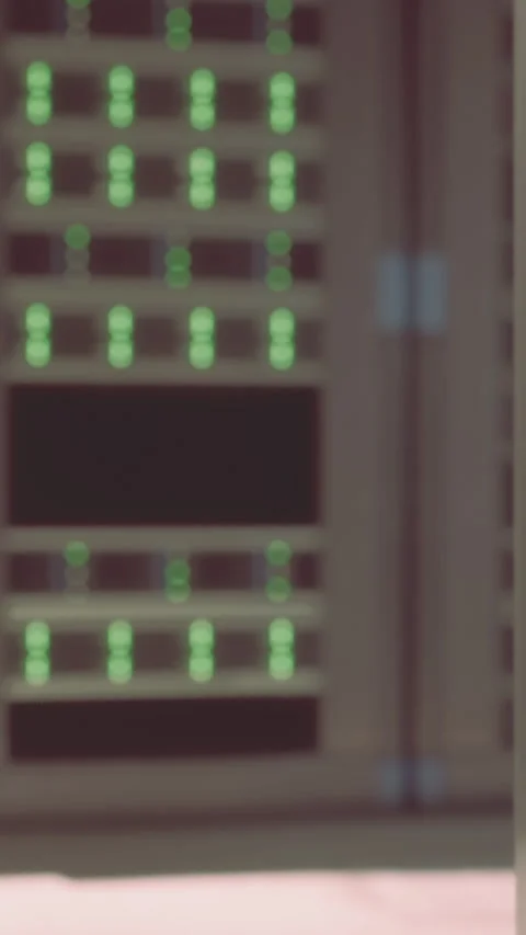 Various lights are on inside a server room in the early afternoon Stock Footage 337927418