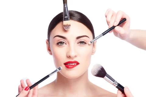 Various make-up brushes near a young model Stock Photos