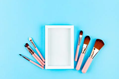 Various Makeup Brushes on blue Background Stockfoto's