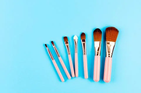 Various Makeup Brushes on blue Background Stockfoto's