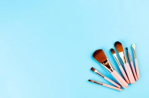 Various Makeup Brushes on blue Background Stockfoto's