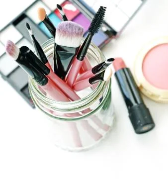 Various makeup brushes on light background Stock Photos