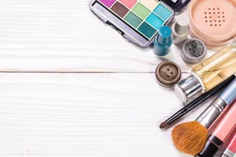 Various makeup products on dark background with copyspace Stock Photos
