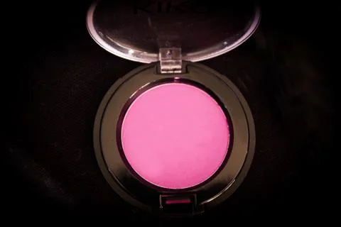 Various makeup shadows on dark background Stock Photos