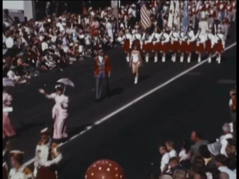 Various marching bands and drill teams pass by in the Schlitz Circus Parade, in Stock Footage 74968228