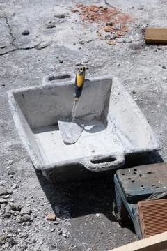 Various masonry and brickwork tools being used on a construction site Stock Photos