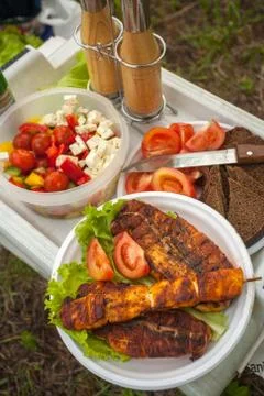 Various meals at picnic on the table Stock Photos