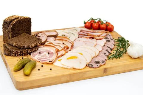 Various meat cold cut platter on a wooden board Stock Photos
