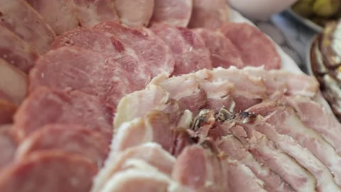 Various meat products on a plate, beef and pork meat, sliced ​​meat Stock Footage 219329462