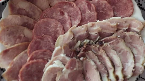 Various meat products on a plate, beef and pork meat, sliced ​​meat Stock Footage 219329473