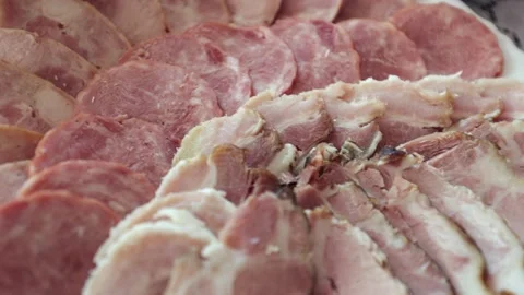 Various meat products on a plate, beef and pork meat, sliced ​​meat Stock Footage 219329482