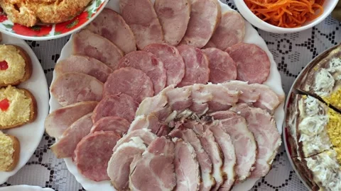 Various meat products on a plate, beef and pork meat, sliced ​​meat Stock Footage 219329490