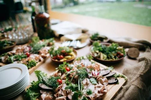 Various meat snacks on the buffet table, catering service outdoor Stock Photos
