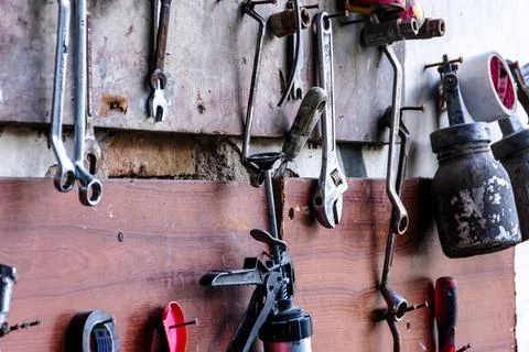 Various mechanic tools for a workshop for auto service and car repair hangs o Stock Photos