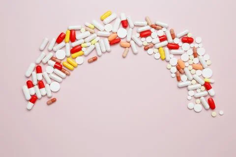 Various medication tablets and capsules. Concept of healthcare and medicine Stock Photos