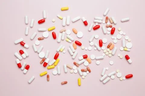 Various medication tablets and capsules. Concept of healthcare and medicine Stock Photos