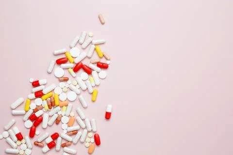 Various medication tablets and capsules. Concept of healthcare and medicine Stock Photos