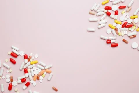 Various medication tablets and capsules. Concept of healthcare and medicine Stock Photos