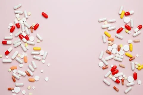 Various medication tablets and capsules. Concept of healthcare and medicine Stock Photos