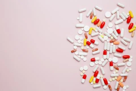 Various medication tablets and capsules. Concept of healthcare and medicine Stock Photos