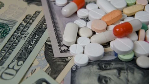 Various medicines on the US dollar. The rising cost of health care Stock Footage