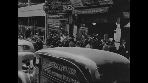 Various men look at job postings help-wanted ads on New York street - 1930 Stock Footage 101429730