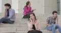 various moods on a cell phone - young men and women with smartphone HD Footage