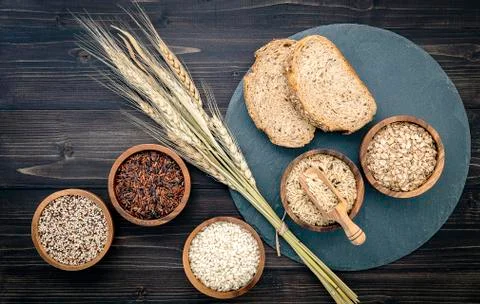 Various natural organic cereal and whole grains seed in wooden bowl for healt Stock Photos