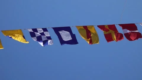 Various nautical flags tied together with rope, Ship flags signals, morse code, Stock Footage 194096639