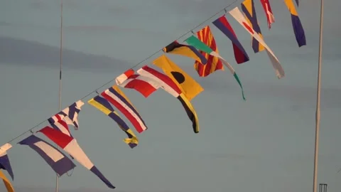 Various nautical flags tied together with rope, Ship flags signals, morse code, Stock Footage 295843467